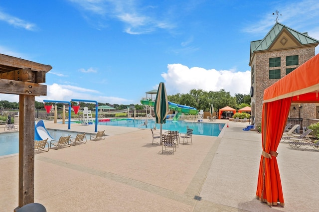 2131 Cranbrook Ridge Ln, Sugar Land, TX 77479 - community pool featuring a water slide, a water play area, and a patio