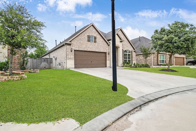 18610 Fairmont Springs Ct, Cypress, TX 77429 - french provincial home featuring brick siding, concrete driveway, and a garage