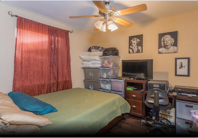 4126 Fort Bend Dr, Galveston, TX 77554 - bedroom featuring dark wood-style floors and ceiling fan