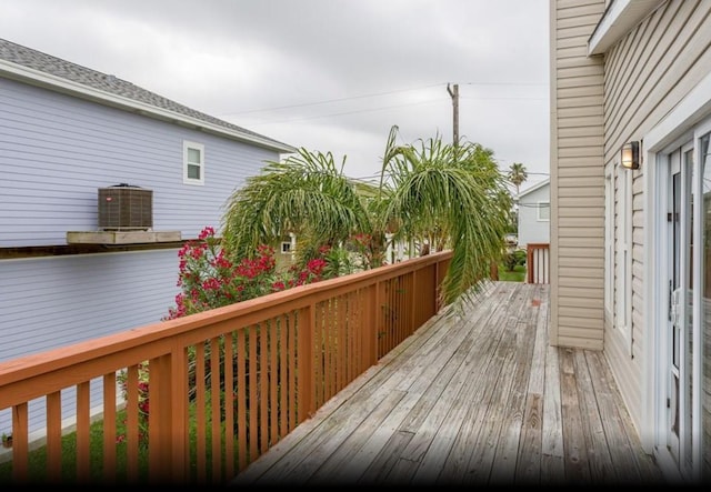 4126 Fort Bend Dr, Galveston, TX 77554 - wooden deck featuring cooling unit