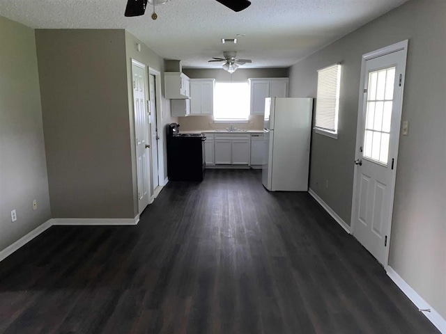 9305 Gardner St, Beaumont, TX 77707 - kitchen featuring freestanding refrigerator, range, a ceiling fan, dark wood finished floors, and baseboards