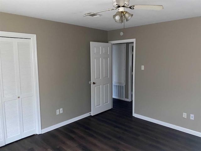 9305 Gardner St, Beaumont, TX 77707 - unfurnished bedroom featuring baseboards, dark wood finished floors, a closet, and ceiling fan