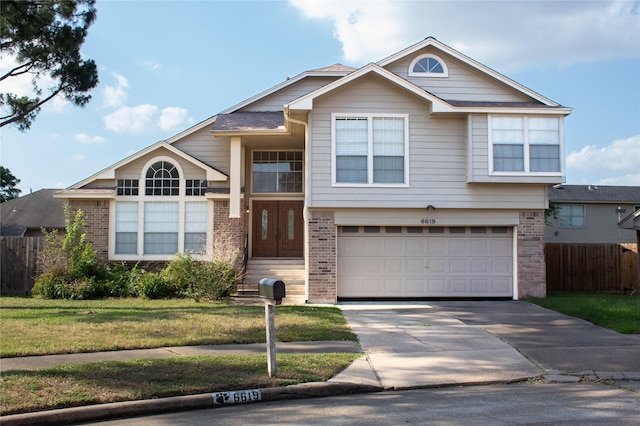 6619 Stonechase, Houston, TX 77084 - view of front facade featuring brick siding, an attached garage, and concrete driveway