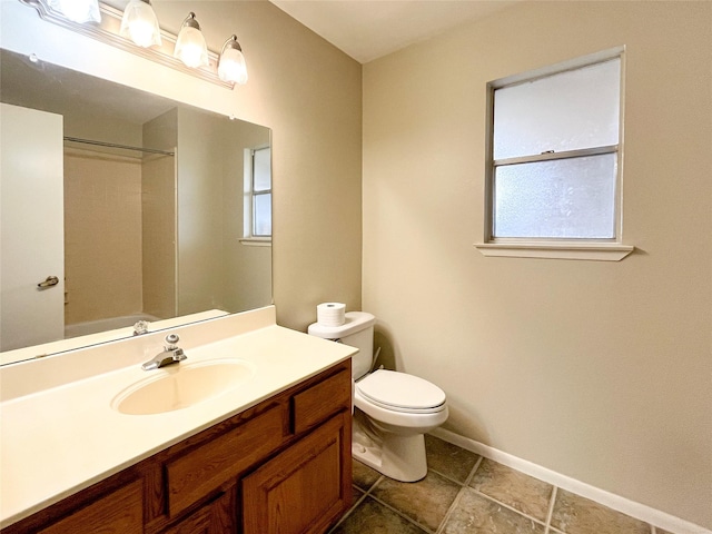 6619 Stonechase, Houston, TX 77084 - bathroom featuring toilet, vanity, baseboards, and healthy amount of natural light