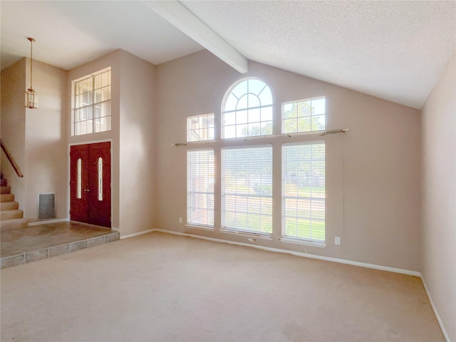 6619 Stonechase, Houston, TX 77084 - foyer entrance featuring carpet flooring, beam ceiling, high vaulted ceiling, baseboards, and stairway