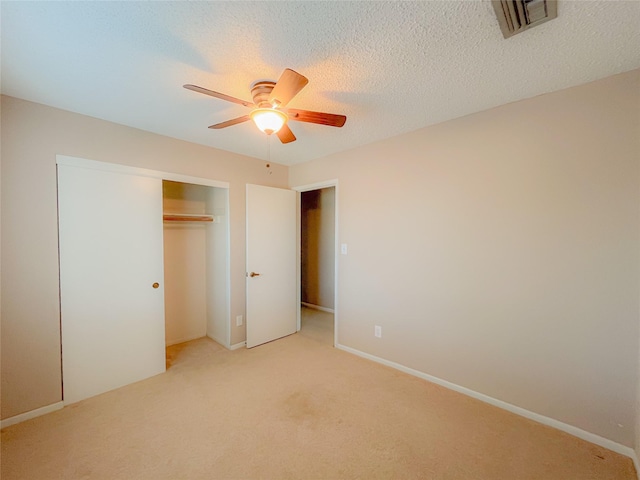 6619 Stonechase, Houston, TX 77084 - unfurnished bedroom featuring a closet, light carpet, and a ceiling fan