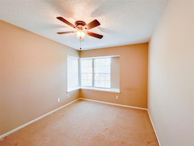 6619 Stonechase, Houston, TX 77084 - carpeted empty room with a ceiling fan, baseboards, and a textured ceiling