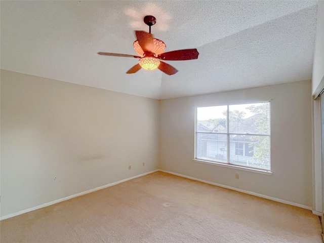 6619 Stonechase, Houston, TX 77084 - spare room featuring ceiling fan, light carpet, baseboards, and a textured ceiling