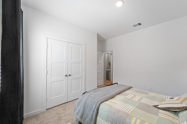 14027 Valley Creek Ct, Conroe, TX 77384 - bedroom featuring light colored carpet and a closet