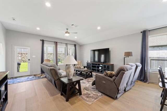 14027 Valley Creek Ct, Conroe, TX 77384 - living area featuring light wood-type flooring, healthy amount of natural light, a ceiling fan, recessed lighting, and vaulted ceiling