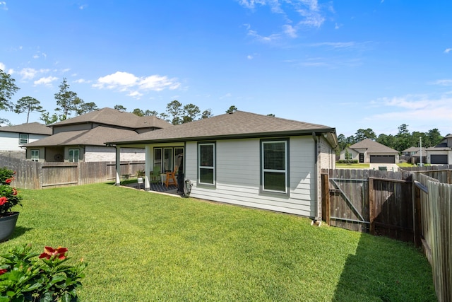 14027 Valley Creek Ct, Conroe, TX 77384 - rear view of property with roof with shingles and a patio area