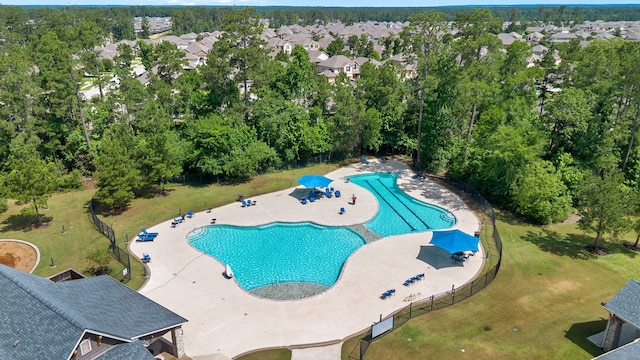 14027 Valley Creek Ct, Conroe, TX 77384 - community pool with a patio and a residential view
