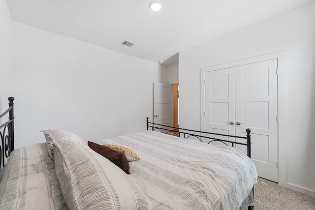 14027 Valley Creek Ct, Conroe, TX 77384 - bedroom featuring light carpet and a closet
