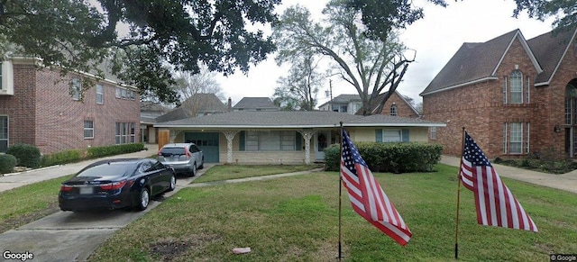 4802 Holly St, Bellaire, TX 77401 - view of front of home featuring driveway, a front yard, and a garage