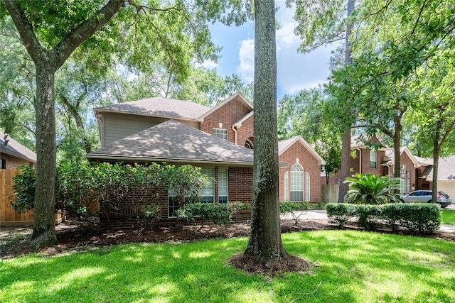 8907 Opus Ct, Houston, TX 77040 - view of front facade with a shingled roof and brick siding