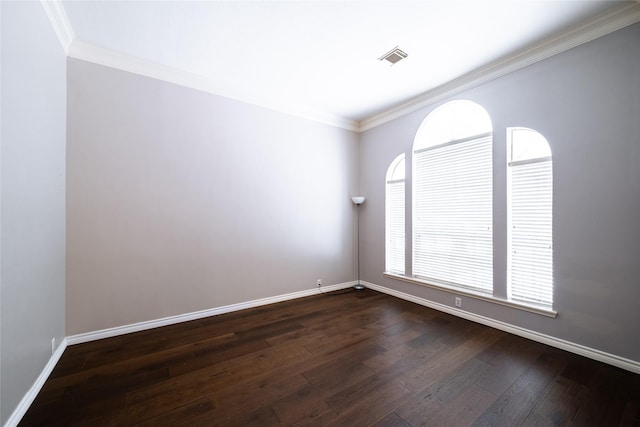 8907 Opus Ct, Houston, TX 77040 - spare room featuring ornamental molding, dark wood-style flooring, and baseboards