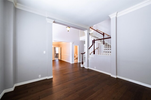 8907 Opus Ct, Houston, TX 77040 - spare room with wood finished floors, stairway, baseboards, ornamental molding, and ornate columns
