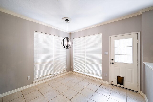 8907 Opus Ct, Houston, TX 77040 - unfurnished dining area with light tile patterned floors, ornamental molding, baseboards, and a chandelier