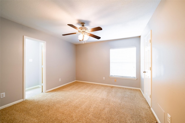 8907 Opus Ct, Houston, TX 77040 - empty room with light colored carpet, a ceiling fan, and baseboards
