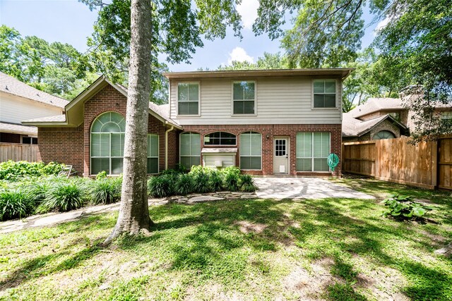 8907 Opus Ct, Houston, TX 77040 - back of property with a patio area and brick siding