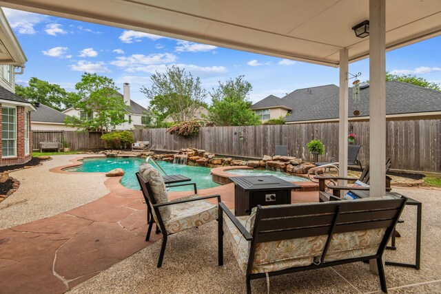 13406 Nottoway Cir, Cypress, TX 77429 - fenced backyard with a patio area and a fire pit