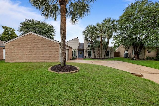 4322 Shady Springs Dr, Pasadena, TX 77586 - mid-century home featuring driveway, an attached garage, brick siding, and a front yard