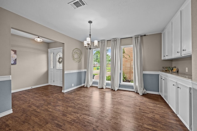 4322 Shady Springs Dr, Pasadena, TX 77586 - unfurnished dining area featuring a chandelier, dark wood-style floors, and baseboards