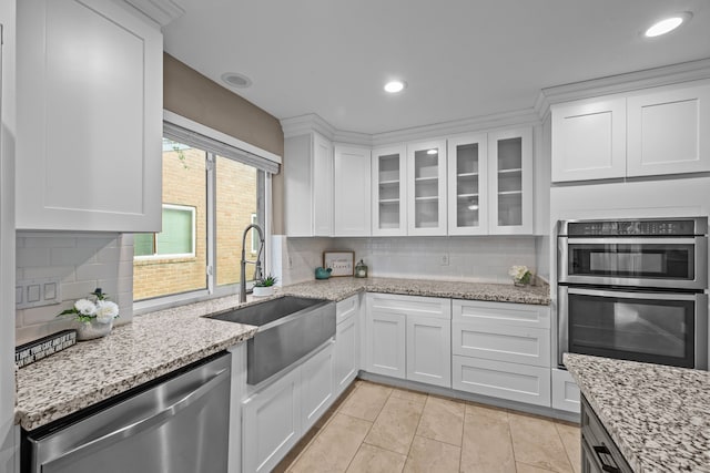 4322 Shady Springs Dr, Pasadena, TX 77586 - kitchen with stainless steel appliances, a sink, white cabinets, decorative backsplash, and recessed lighting