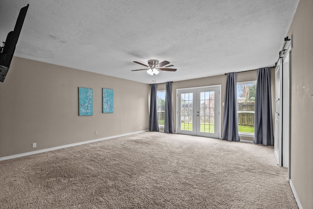 4322 Shady Springs Dr, Pasadena, TX 77586 - carpeted empty room featuring a textured ceiling, baseboards, ceiling fan, and french doors