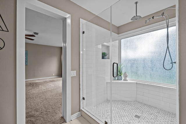 4322 Shady Springs Dr, Pasadena, TX 77586 - full bathroom featuring a stall shower, ceiling fan, and baseboards