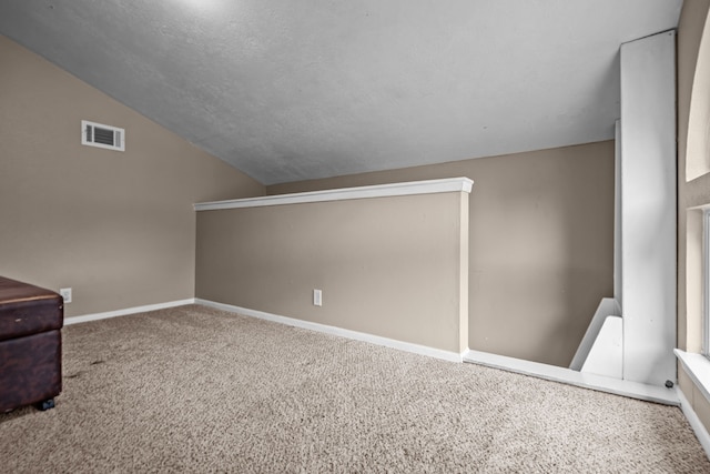 4322 Shady Springs Dr, Pasadena, TX 77586 - bonus room featuring vaulted ceiling, carpet, baseboards, and a textured ceiling