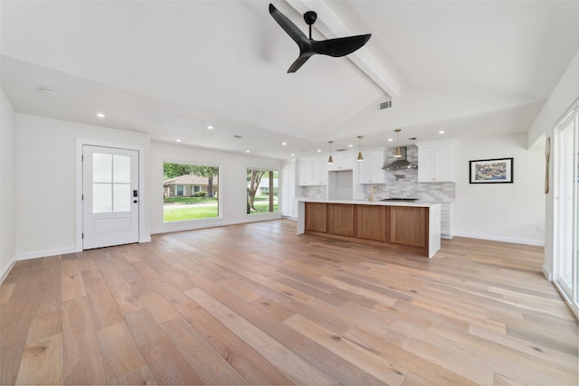 2618 Pine Village Dr, Houston, TX 77080 - unfurnished living room with light wood-style flooring, recessed lighting, ceiling fan, and baseboards