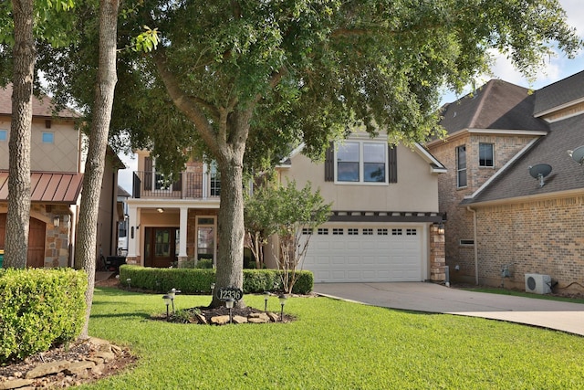 12336 Pebble View Dr, Conroe, TX 77304 - view of front facade with driveway, an attached garage, a front yard, stucco siding, and a balcony