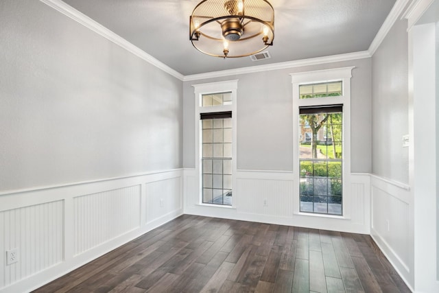 12336 Pebble View Dr, Conroe, TX 77304 - spare room with dark wood finished floors, a chandelier, ornamental molding, and a wainscoted wall