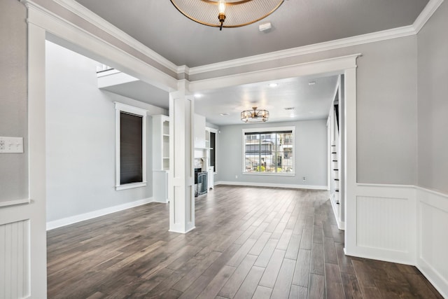 12336 Pebble View Dr, Conroe, TX 77304 - unfurnished living room featuring dark wood-style floors, crown molding, decorative columns, a chandelier, and baseboards