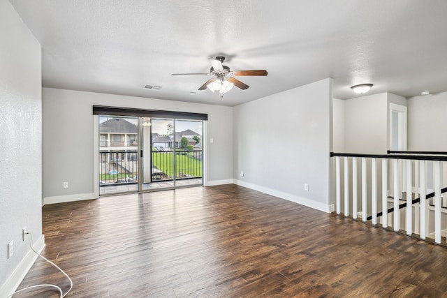 12336 Pebble View Dr, Conroe, TX 77304 - unfurnished room with ceiling fan, wood finished floors, and baseboards