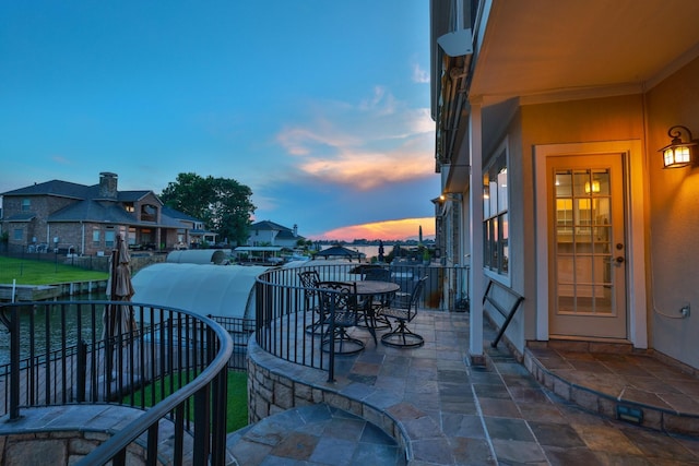 12336 Pebble View Dr, Conroe, TX 77304 - patio terrace at dusk with a balcony and a residential view