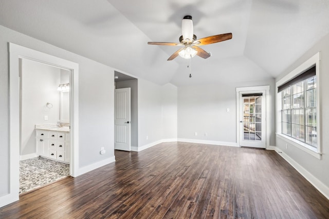 12336 Pebble View Dr, Conroe, TX 77304 - unfurnished room featuring dark wood-style floors, a ceiling fan, lofted ceiling, a sink, and baseboards
