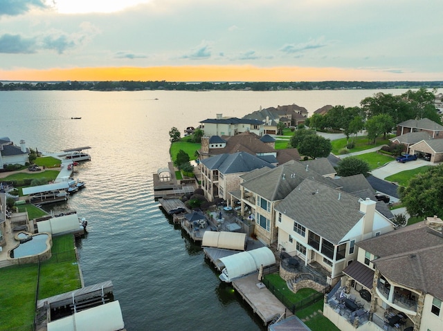 12336 Pebble View Dr, Conroe, TX 77304 - aerial view at dusk of a water view and a residential view