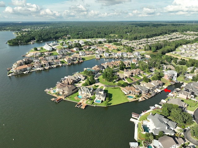12336 Pebble View Dr, Conroe, TX 77304 - aerial view of property and surrounding area featuring nearby suburban area, a heavily wooded area, and a large body of water