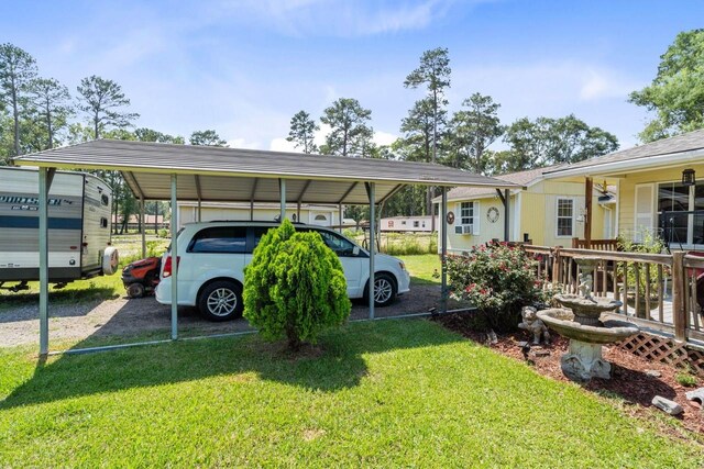 24027 Spears Cir, New Caney, TX 77357 - view of parking with a carport and driveway