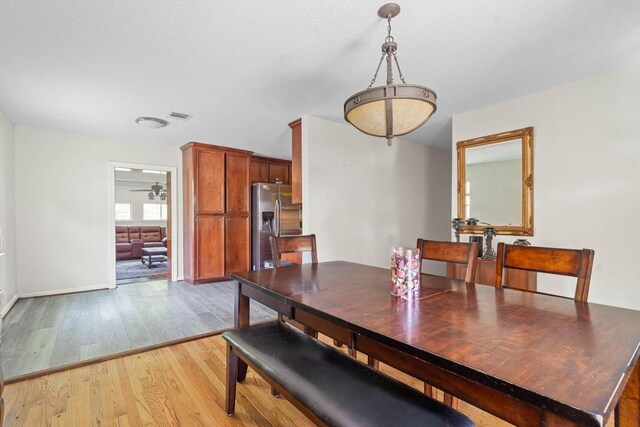 24027 Spears Cir, New Caney, TX 77357 - dining space with light wood-style floors and baseboards
