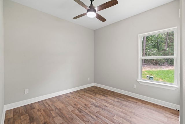 15608 Navajo Trl, Willis, TX 77378 - unfurnished room featuring baseboards, wood finished floors, and ceiling fan