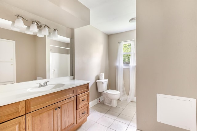 2198 N Winfree St, Dayton, TX 77535 - full bathroom featuring toilet, vanity, tile patterned floors, baseboards, and a shower