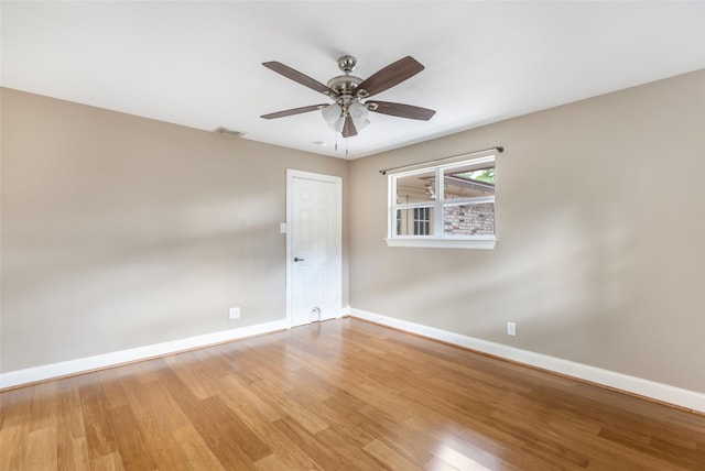 2198 N Winfree St, Dayton, TX 77535 - unfurnished room featuring baseboards, light wood-style floors, and a ceiling fan