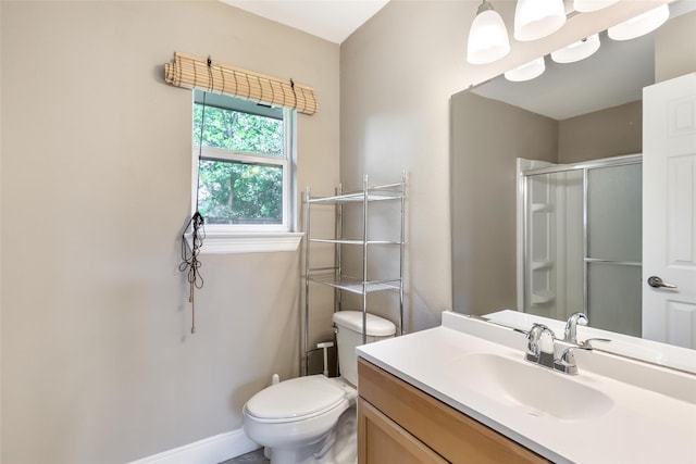 2198 N Winfree St, Dayton, TX 77535 - bathroom with an enclosed shower, toilet, vanity, and baseboards