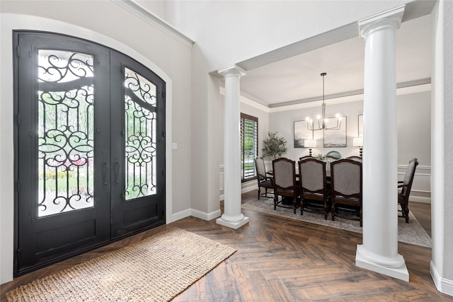 11 Bees Creek Ct, Missouri City, TX 77459 - foyer entrance featuring french doors, baseboards, a chandelier, ornate columns, and arched walkways