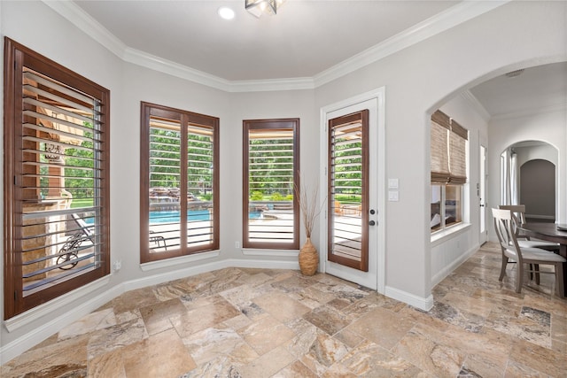 11 Bees Creek Ct, Missouri City, TX 77459 - entryway featuring stone tile floors, arched walkways, crown molding, and baseboards