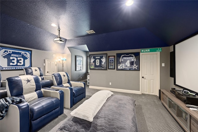 11 Bees Creek Ct, Missouri City, TX 77459 - carpeted cinema with vaulted ceiling, a textured ceiling, and baseboards
