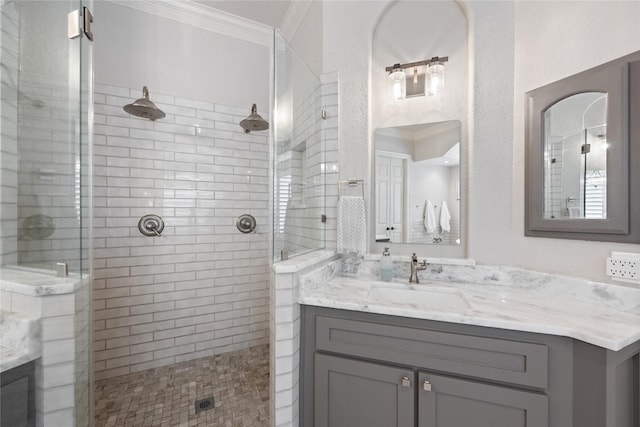 11 Bees Creek Ct, Missouri City, TX 77459 - full bath with tiled shower, vanity, and crown molding